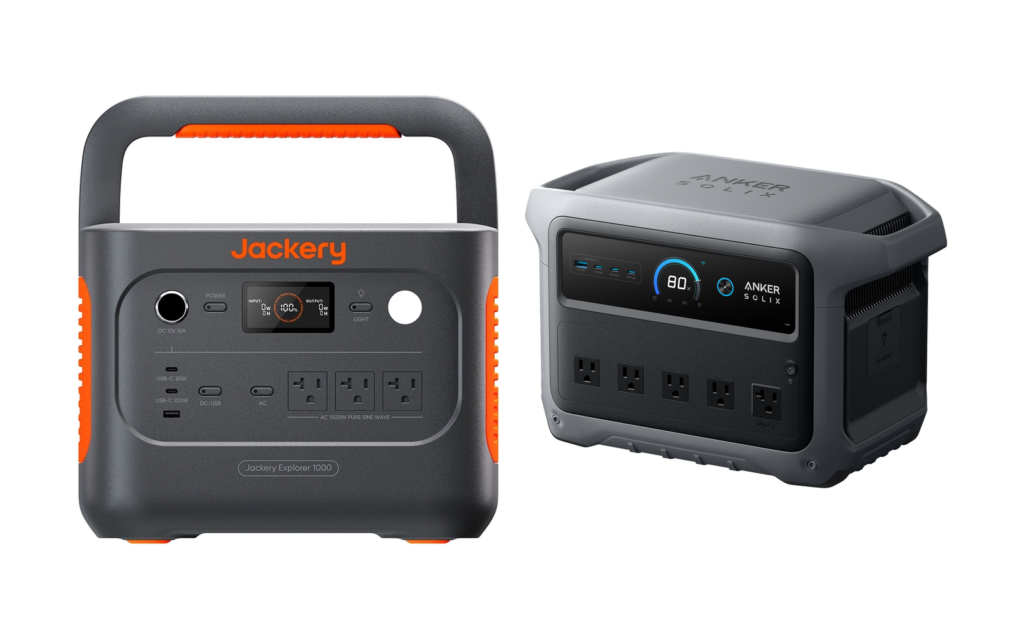 Two portable power stations side by side: an orange and grey Jackery with a top handle and three AC outlets on the left, and a dark grey Anker SOLIX with five AC outlets and a round display on the right.